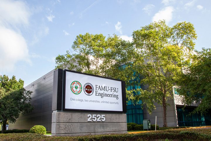 An outdoor campus sign reads 