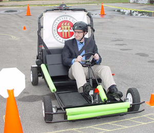 Donald Post, Student Government Association Director of Health Services, tries out the SIDNE vehicle.