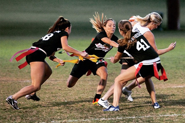 Students playing intramural flag football
