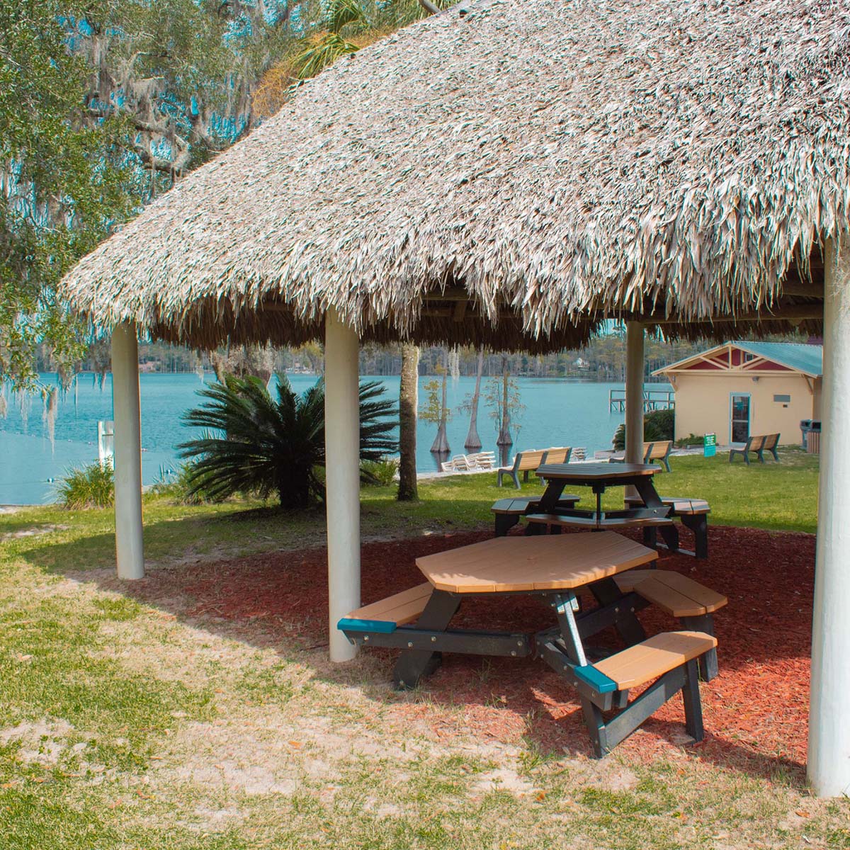 Traditional Seminole chickee at FSU Lakefront Park with thatched roof on stilts