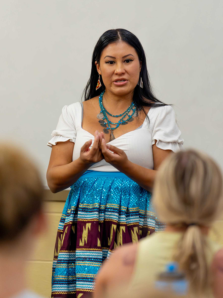 Seminole Tribe member JoJo Osceola teaching FSU student athletes about Seminole culture