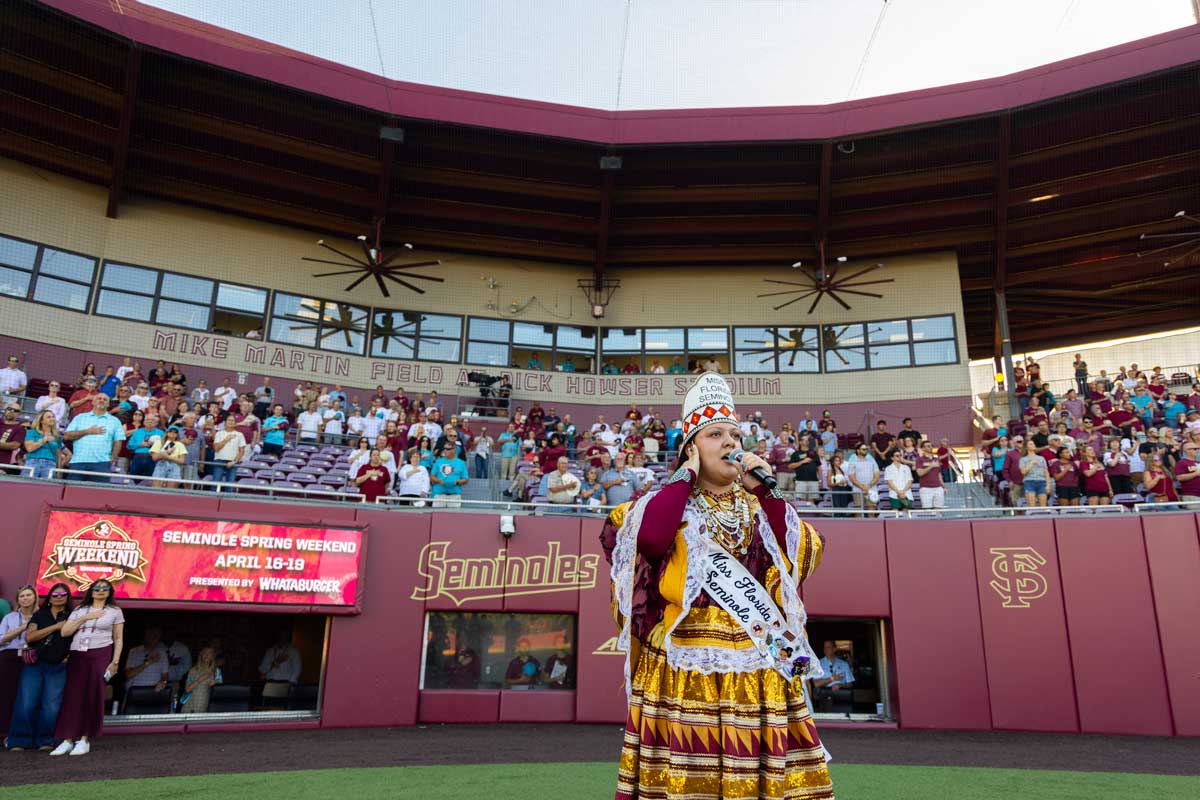 Miss Florida Seminole Bailey Marie Latchford performing the National Anthem at FSU's Seminole Heritage baseball game