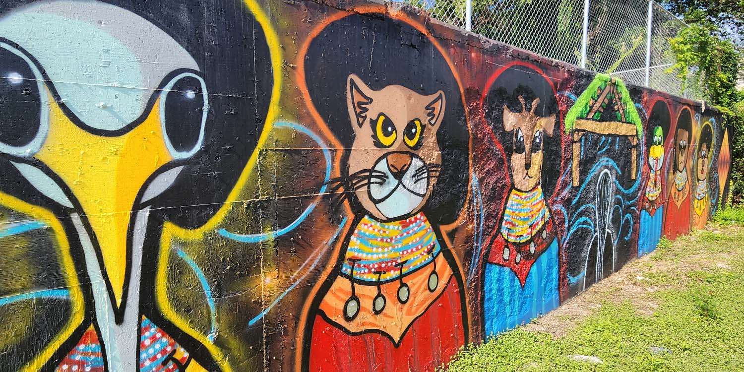 135-foot Seminole mural on Macomb Street depicting clans, patchwork, and creation story