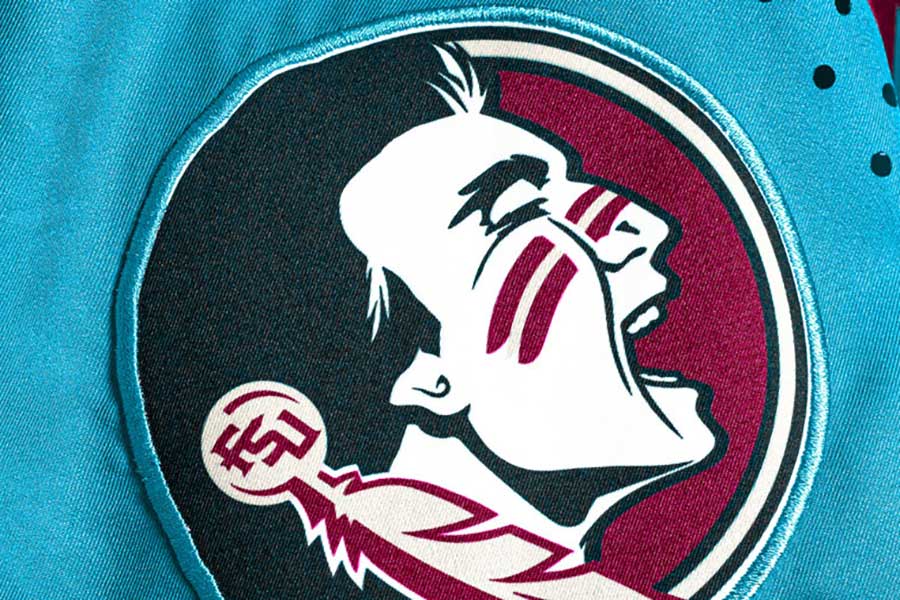 Turquoise patch design on FSU uniform honoring Seminole heritage