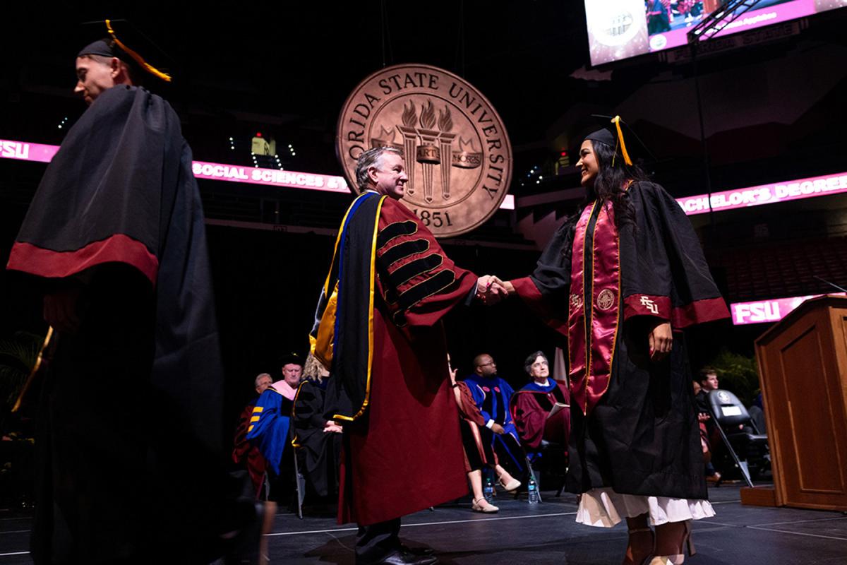 FSU President Richard McCullough congratulates a graduate during commencement. 